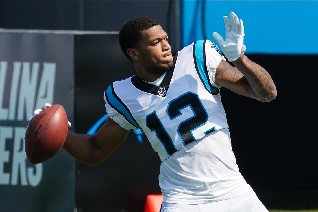 Oct 4, 2020; Charlotte, North Carolina, USA; Carolina Panthers wide receiver D.J. Moore (12) throws the ball back during pre-game warm ups before a game against the Arizona Cardinals at Bank of America Stadium. Mandatory Credit: Jim Dedmon-USA TODAY Sports