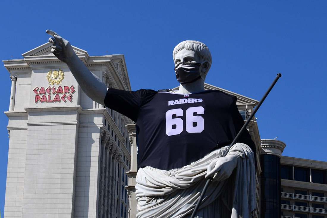 Oct 4, 2020; Paradise, Nevada, USA;  A general view of Caesar's Palace statue with Las Vegas Raiders jersey and face mask at the New York-New York Hotel & Casino. Mandatory Credit: Kirby Lee-USA TODAY Sports