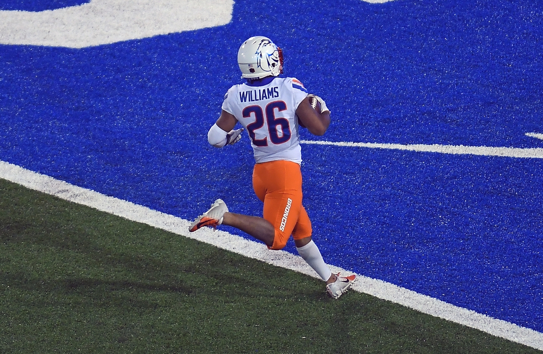 Oct 31, 2020; Colorado Springs, Colorado, USA; Boise State Broncos cornerback Avery Williams (26) scores an eighty eight yard kickoff return in the second half against the Air Force Falcons at Falcon Stadium. Mandatory Credit: Ron Chenoy-USA TODAY Sports