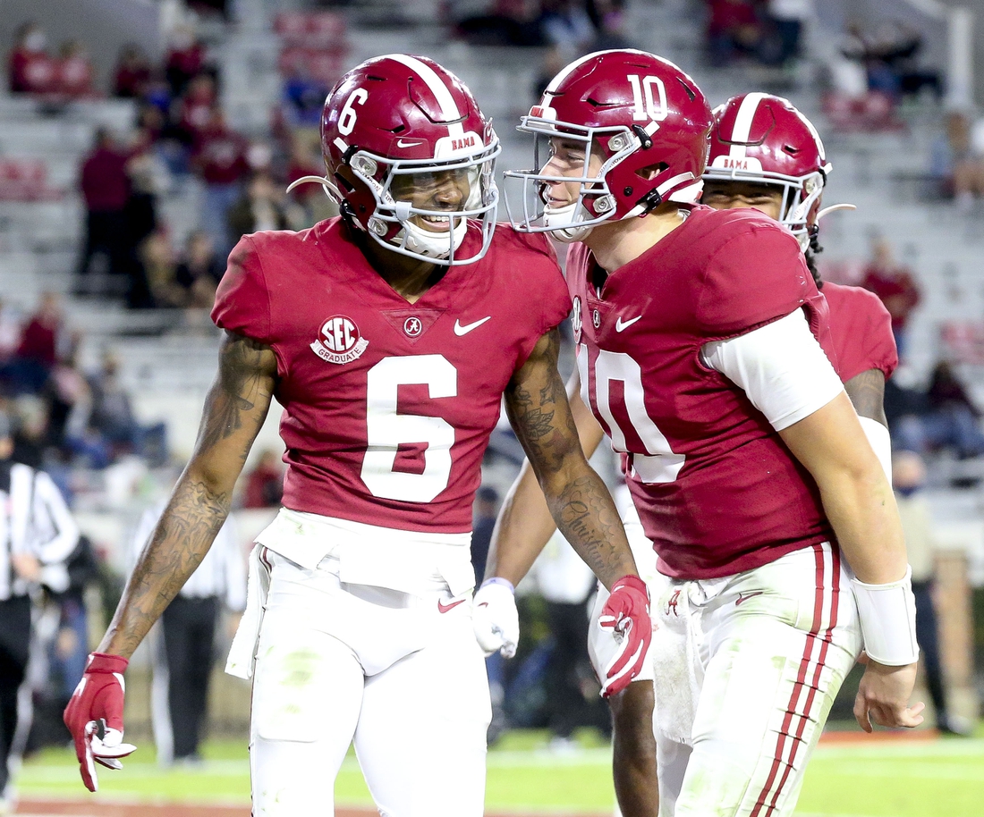 Oct 31, 2020; Tuscaloosa, Alabama, USA;  Alabama wide receiver DeVonta Smith (6) and Alabama quarterback Mac Jones (10) celebrate a touchdown pass from Jones to Smith at Bryant-Denny Stadium during the second half of Alabama's 41-0 win over Mississippi State. Mandatory Credit: Gary Cosby Jr/The Tuscaloosa News via USA TODAY Sports