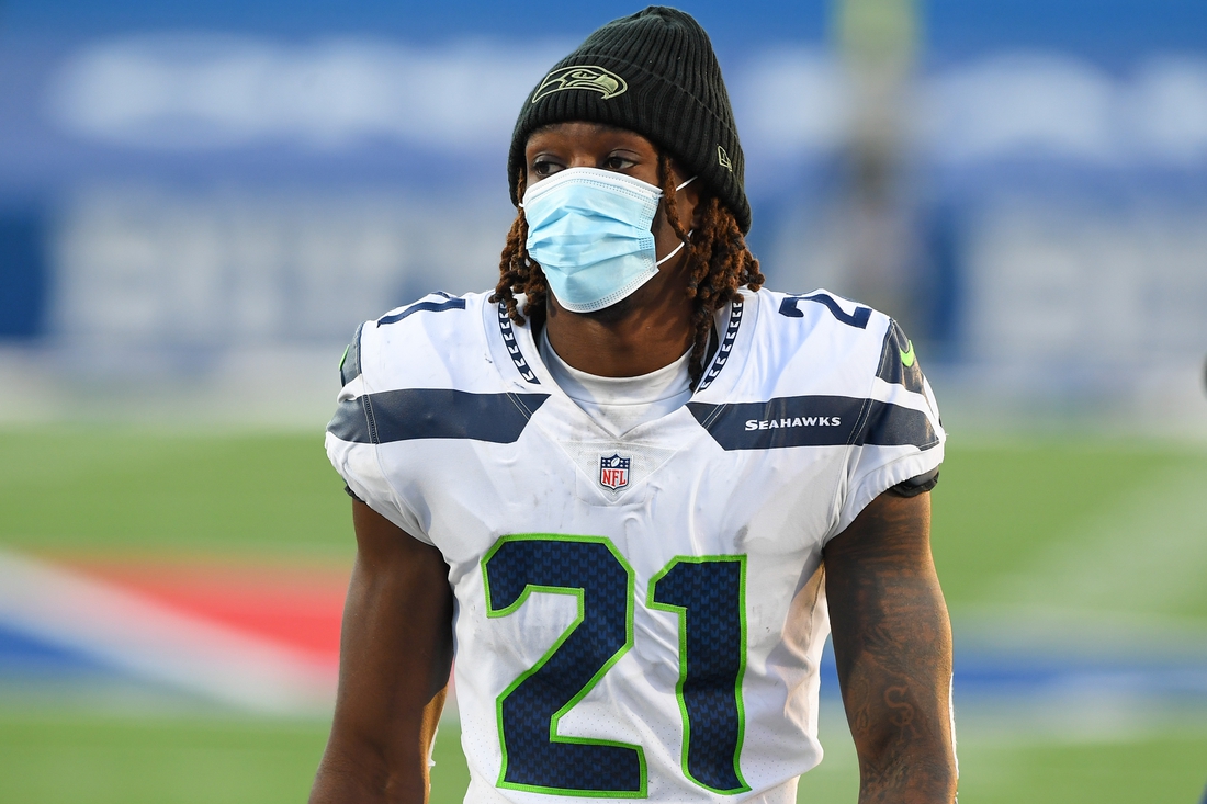 Nov 8, 2020; Orchard Park, New York, USA; Seattle Seahawks cornerback Tre Flowers (21) walks off the field wearing a mask following the game against the Buffalo Bills at Bills Stadium. Mandatory Credit: Rich Barnes-USA TODAY Sports