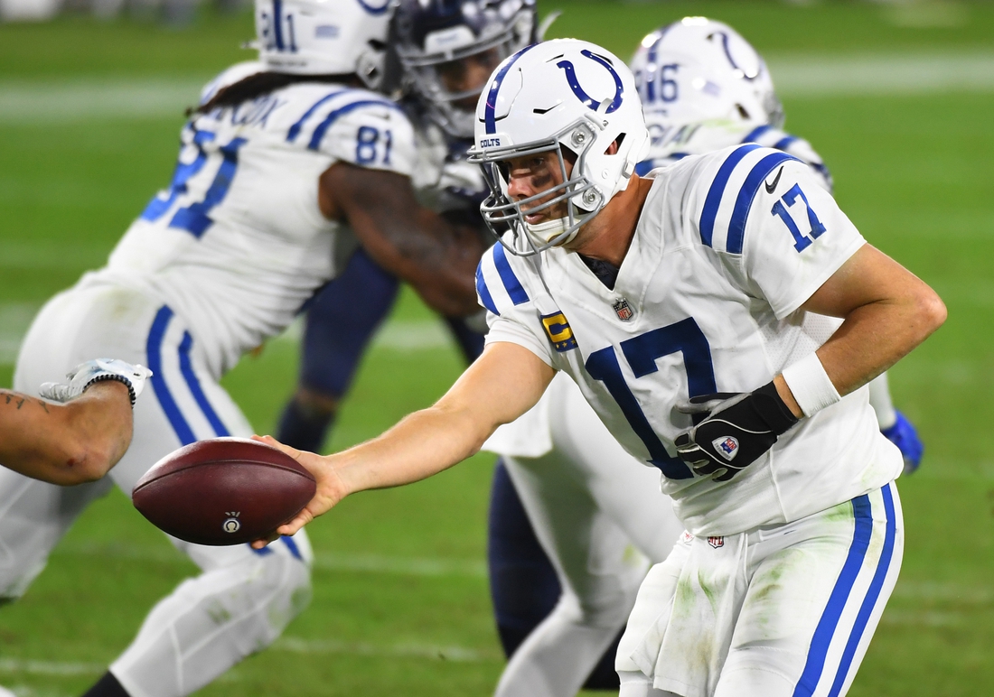 Nov 12, 2020; Nashville, Tennessee, USA; Indianapolis Colts quarterback Philip Rivers (17) hands the ball off during the second half against the Tennessee Titans at Nissan Stadium. Mandatory Credit: Christopher Hanewinckel-USA TODAY Sports