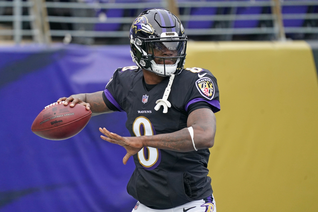Nov 22, 2020; Baltimore, Maryland, USA; Baltimore Ravens  quarterback Lamar Jackson (8) warms up prior to the game against the Tennessee Titans at M&T Bank Stadium. Mandatory Credit: Mitch Stringer-USA TODAY Sports