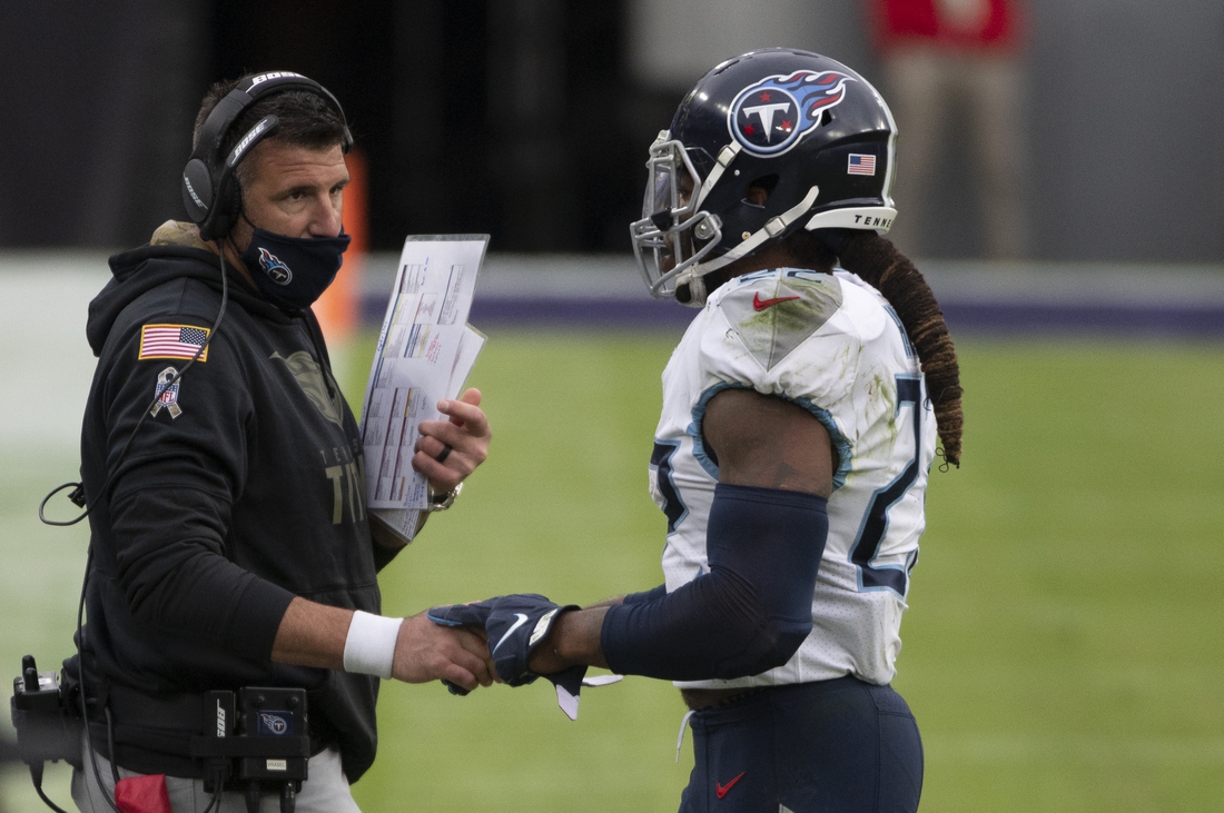 Nov 22, 2020; Baltimore, Maryland, USA;  Tennessee Titans running back Derrick Henry (22) speaks with  head coach Mike Vrabel during the second half against the Baltimore Ravens at M&T Bank Stadium. Mandatory Credit: Tommy Gilligan-USA TODAY Sports