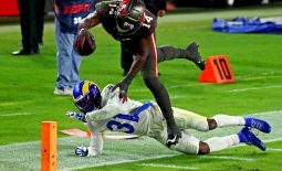 Nov 23, 2020; Tampa, Florida, USA;  Tampa Bay Buccaneers wide receiver Chris Godwin (14) dives for a touchdown  against Los Angeles Rams defensive back Darious Williams (31) during the fourth quarter at Raymond James Stadium. Mandatory Credit: Kim Klement-USA TODAY Sports