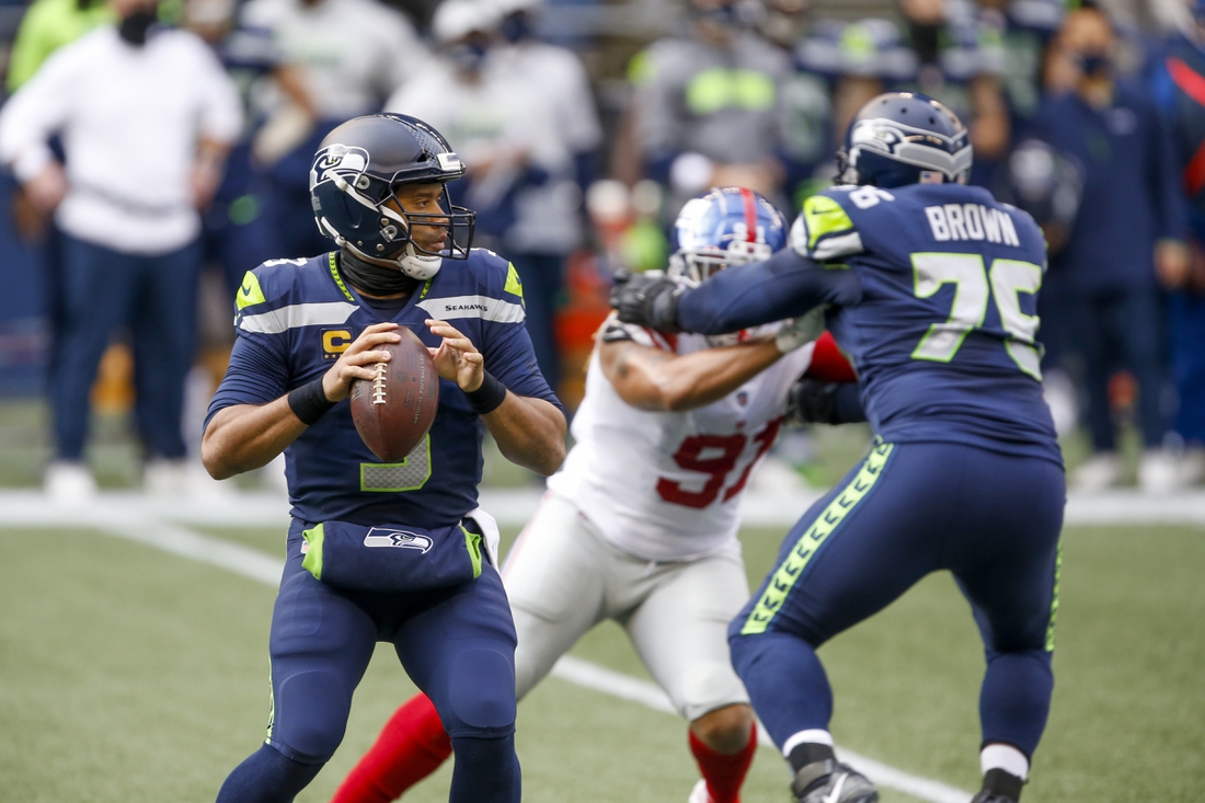Dec 6, 2020; Seattle, Washington, USA; Seattle Seahawks quarterback Russell Wilson (3) drops back to pass against the New York Giants during the first quarter at Lumen Field. Mandatory Credit: Joe Nicholson-USA TODAY Sports