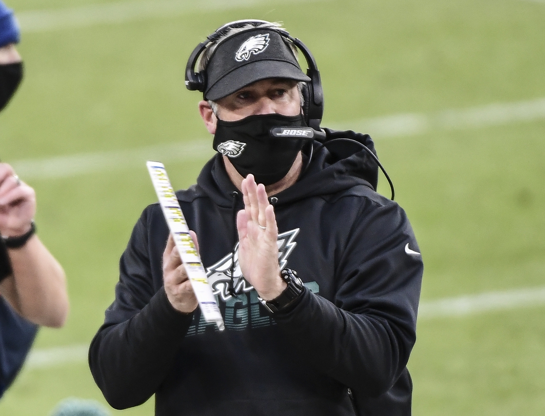 Dec 6, 2020; Green Bay, Wisconsin, USA; Philadelphia Eagles head coach Doug Pederson reacts after a field goal in the first quarter during the game against the Green Bay Packers at Lambeau Field. Mandatory Credit: Benny Sieu-USA TODAY Sports