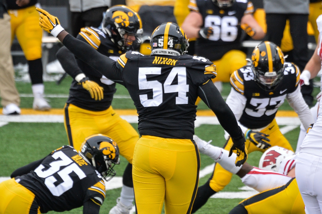 Dec 12, 2020; Iowa City, Iowa, USA; Iowa Hawkeyes defensive tackle Daviyon Nixon (54) reacts after a fumble recovery against the Wisconsin Badgers during the first quarter at Kinnick Stadium. Mandatory Credit: Jeffrey Becker-USA TODAY Sports