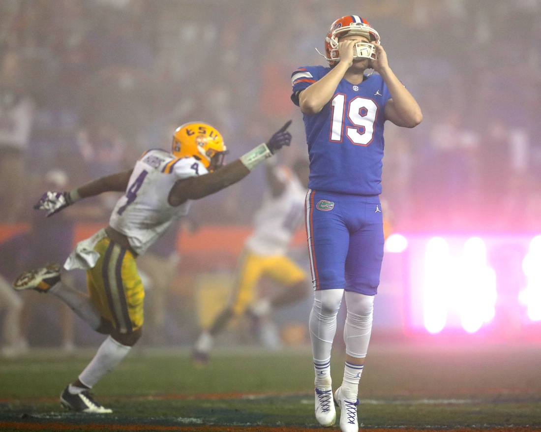 Dec 12, 2020; Gainesville, FL, USA;  Florida Gators kicker Evan McPherson (19) hold his helmet in dejection after missing a last second field goal that would have tied the game during a game against the LSU Tigers at Ben Hill Griffin Stadium in Gainesville, Fla. Dec. 12, 2020. Florida lost 37-34 to the Tigers.   Mandatory Credit: Brad McClenny-USA TODAY NETWORK