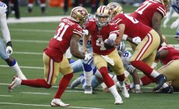 Dec 20, 2020; Arlington, Texas, USA; San Francisco 49ers quarterback Nick Mullens (4) hands off to running back Raheem Mostert (31) against the Dallas Cowboys in the first quarter at AT&T Stadium. Mandatory Credit: Tim Heitman-USA TODAY Sports