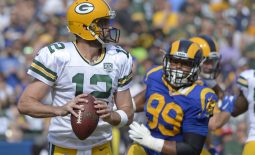 Oct 28, 2018; Los Angeles, CA, USA; Green Bay Packers quarterback Aaron Rodgers (12) looks to pass as Los Angeles Rams defensive tackle Aaron Donald (99) rushes during the first quarter at Los Angeles Memorial Coliseum. Mandatory Credit: Jake Roth-USA TODAY Sports