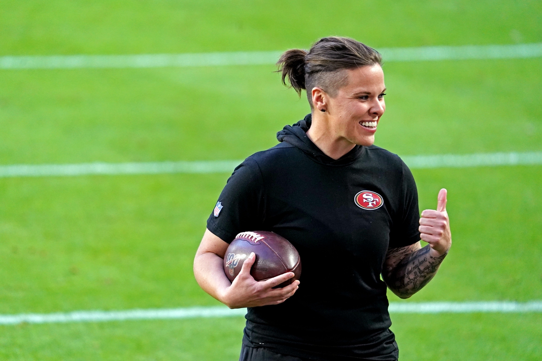 Feb 2, 2020; Miami Gardens, Florida, USA;  San Francisco 49ers offensive assistant coach Katie Sowers    before Super Bowl LIV against the Kansas City Chiefs at Hard Rock Stadium. Mandatory Credit: Kirby Lee-USA TODAY Sports