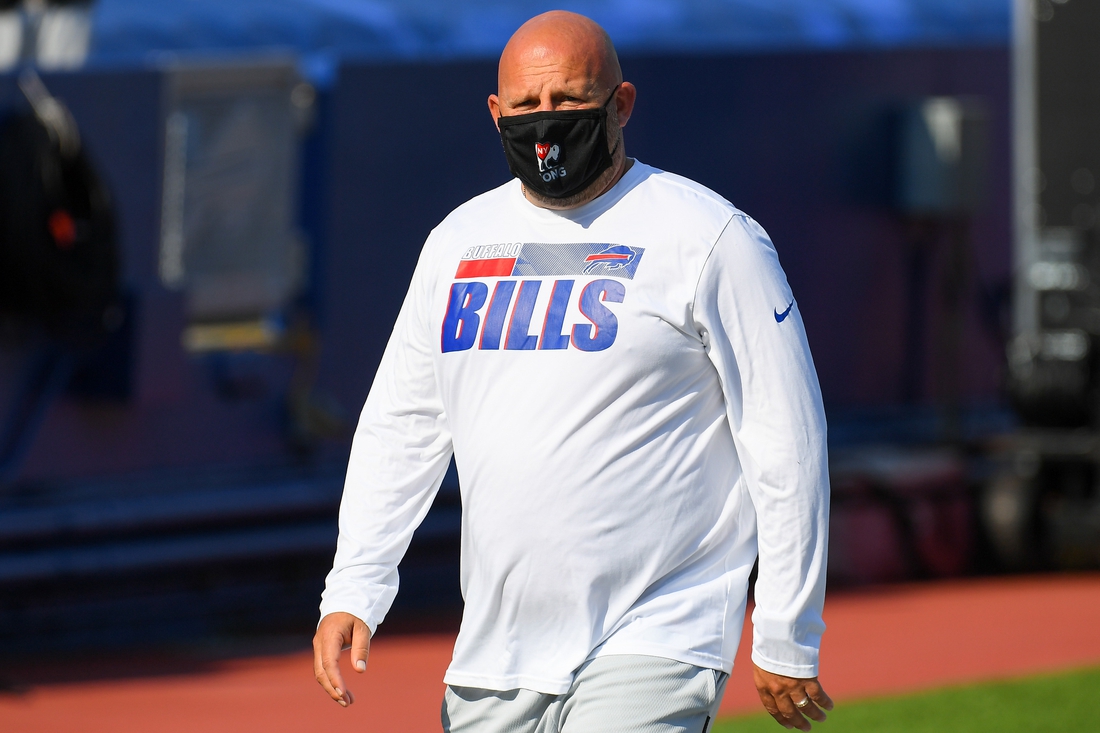 Sep 27, 2020; Orchard Park, New York, USA; Buffalo Bills offensive coordinator Brian Daboll walks the field while wearing a mask prior to the game against the Los Angeles Rams at Bills Stadium. Mandatory Credit: Rich Barnes-USA TODAY Sports