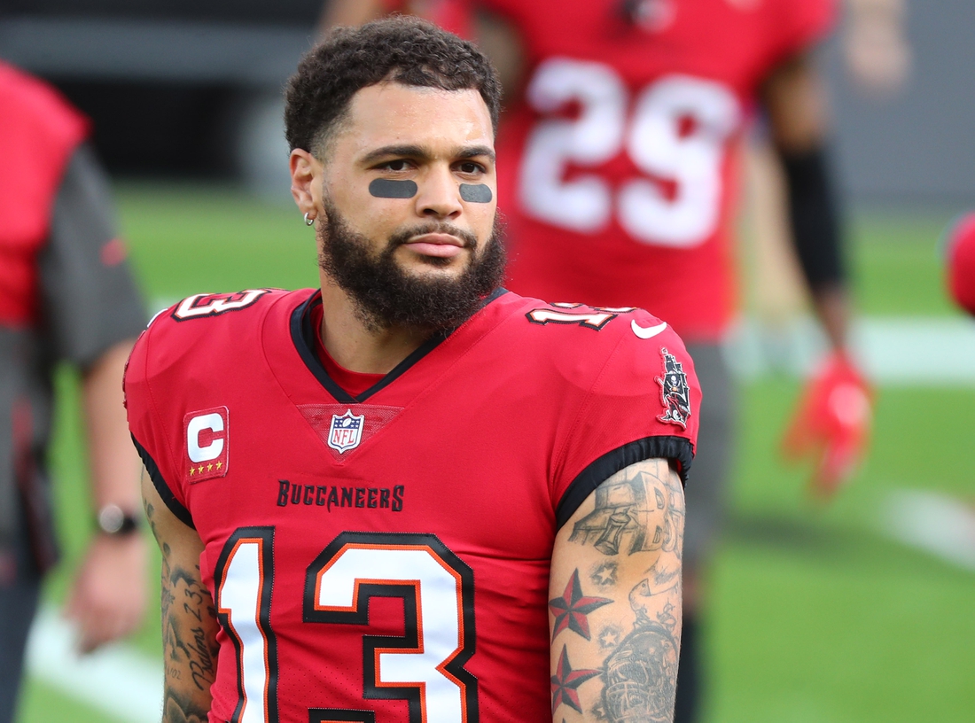 Dec 13, 2020; Tampa, Florida, USA; Tampa Bay Buccaneers wide receiver Mike Evans (13) works out prior to the game against the Minnesota Vikings at Raymond James Stadium. Mandatory Credit: Kim Klement-USA TODAY Sports