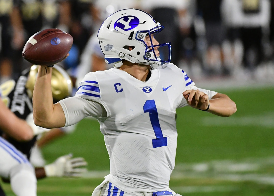Dec 22, 2020; Boca Raton, Florida, USA; Brigham Young Cougars quarterback Zach Wilson (1) attempts a pass against the UCF Knights during the first half at FAU Stadium. Mandatory Credit: Jasen Vinlove-USA TODAY Sports