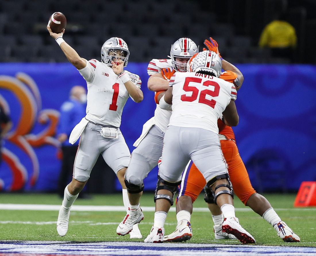 Jan 1, 2021; New Orleans, LA, USA; Ohio State Buckeyes quarterback Justin Fields (1) throws the ball against Clemson Tigers in the third quarter during the College Football Playoff semifinal at the Allstate Sugar Bowl in the Mercedes-Benz Superdome in New Orleans on Friday, Jan. 1, 2021.  Mandatory Credit: Ken Ruinard-USA TODAY Sports