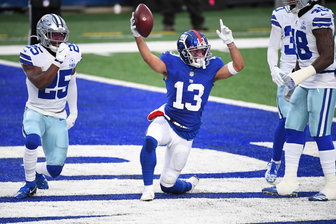Jan 3, 2021; East Rutherford, NJ, USA;  New York Giants receiver Dante Pettis (13) reacts after making a touchdown catch against the Dallas Cowboys in the first half at MetLife Stadium. Mandatory Credit: Robert Deutsch-USA TODAY Sports