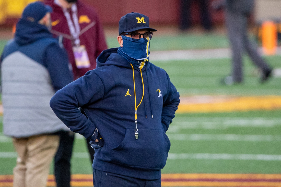 Oct 24, 2020; Minneapolis, Minnesota, USA; Michigan Wolverines head coach Jim Harbaugh looks on during pre game warmups before a game against the Minnesota Golden Gophers at TCF Bank Stadium. Mandatory Credit: Jesse Johnson-USA TODAY Sports