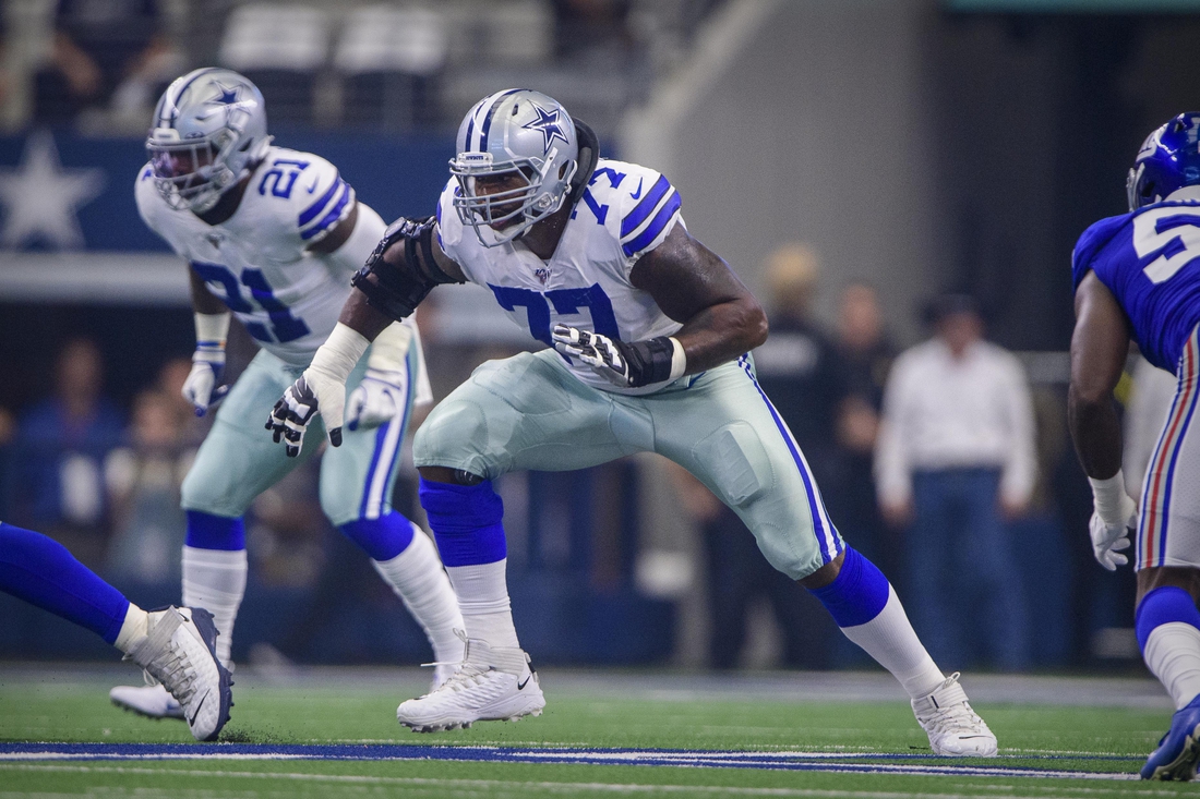 Sep 8, 2019; Arlington, TX, USA; Dallas Cowboys offensive tackle Tyron Smith (77) and running back Ezekiel Elliott (21) in action during the game between the Cowboys and the Giants at AT&T Stadium. Mandatory Credit: Jerome Miron-USA TODAY Sports