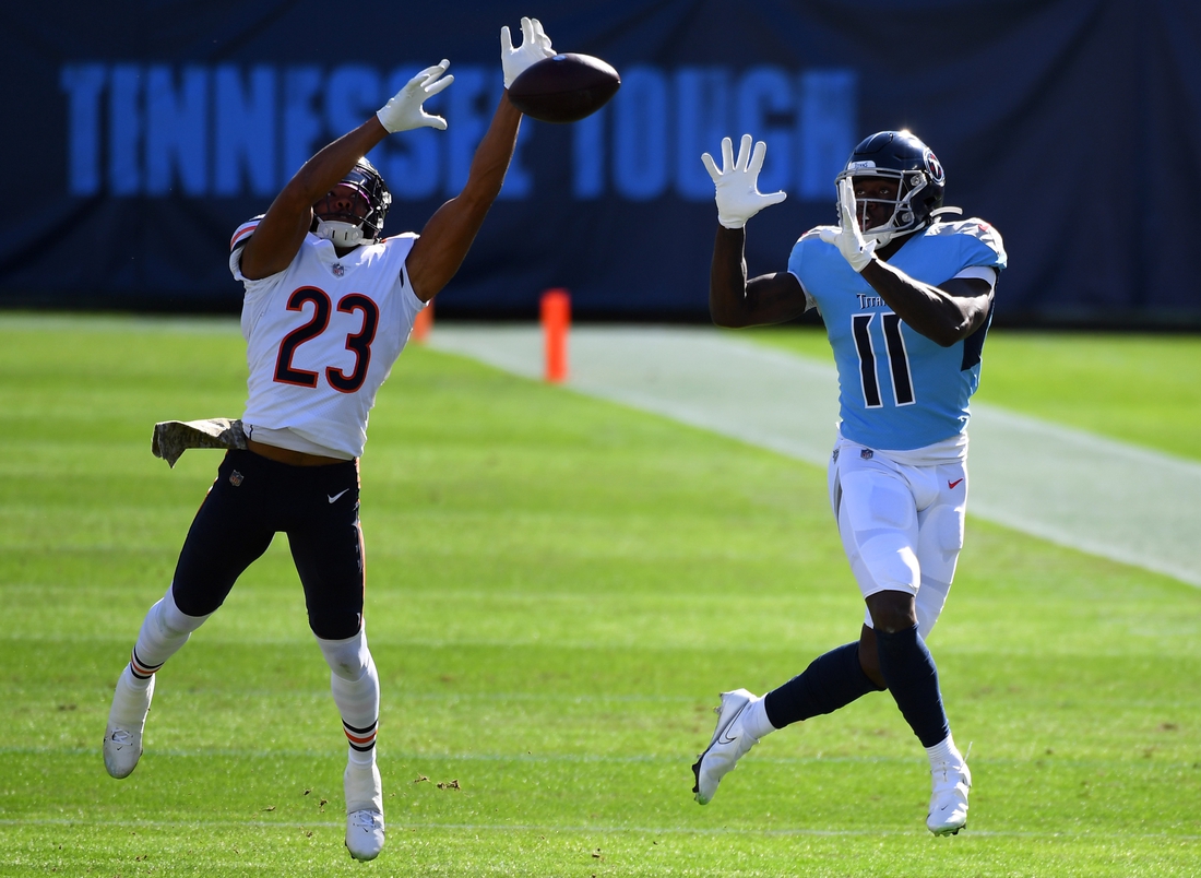 Nov 8, 2020; Nashville, Tennessee, USA; Chicago Bears cornerback Kyle Fuller (23) breaks up a pass intended for Tennessee Titans wide receiver A.J. Brown (11) during the first half at Nissan Stadium. Mandatory Credit: Christopher Hanewinckel-USA TODAY Sports