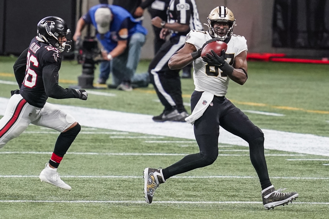 Dec 6, 2020; Atlanta, Georgia, USA; New Orleans Saints tight end Jared Cook (87) makes a catch in front of Atlanta Falcons cornerback Isaiah Oliver (26) during the second half at Mercedes-Benz Stadium. Mandatory Credit: Dale Zanine-USA TODAY Sports
