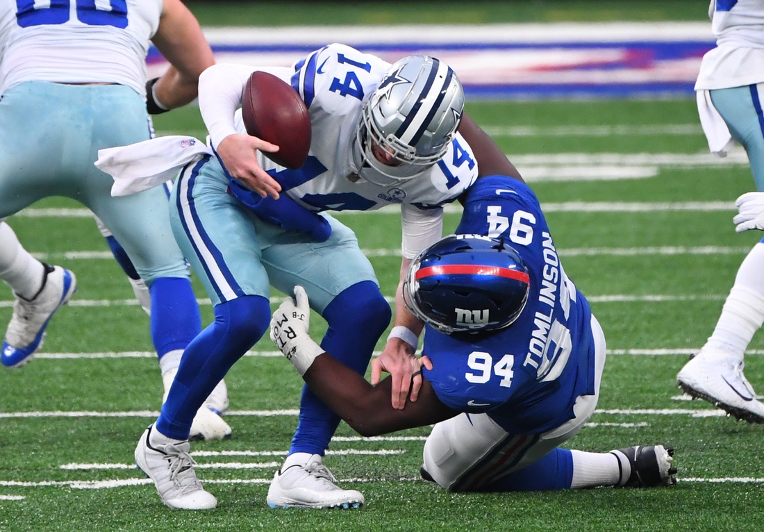 Jan 3, 2021; East Rutherford, NJ, USA; Dallas Cowboys quarterback Andy Dalton (14) is sacked by New York Giants nose tackle Dalvin Tomlinson (94) in the first half at MetLife Stadium. Mandatory Credit: Robert Deutsch-USA TODAY Sports