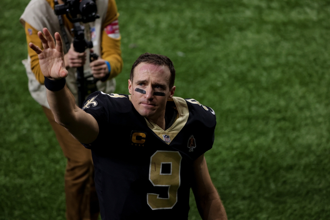 Jan 17, 2021; New Orleans, Louisiana, USA; New Orleans Saints quarterback Drew Brees (9) blows a kiss to his family as he walks to the tunnel following a 30-20 loss against the Tampa Bay Buccaneers in a NFC Divisional Round playoff game at the Mercedes-Benz Superdome. Mandatory Credit: Derick E. Hingle-USA TODAY Sports