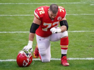 Jan 17, 2021; Kansas City, Missouri, USA; Kansas City Chiefs offensive tackle Eric Fisher (72) kneels on field before the AFC Divisional Round playoff game against the Cleveland Browns at Arrowhead Stadium. Mandatory Credit: Denny Medley-USA TODAY Sports