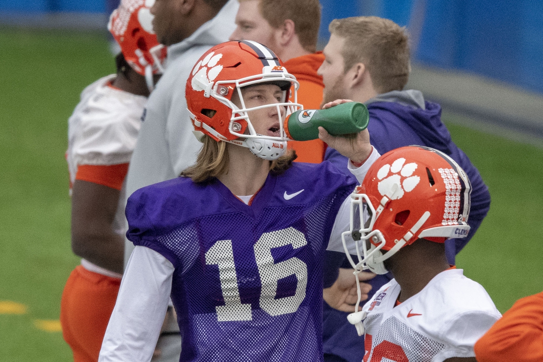 Jan 5, 2019; San Jose, CA, USA; Clemson Tigers quarterback Trevor Lawrence (16) drinks from a Gatorade bottle during practice prior to the CFP National Championship against the Alabama Crimson Tide at CEFCU Stadium. Mandatory Credit: Kyle Terada-USA TODAY Sports