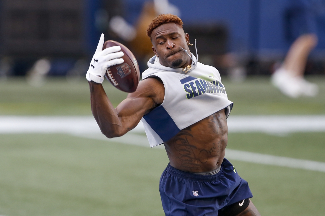 Jan 9, 2021; Seattle, Washington, USA; Seattle Seahawks wide receiver DK Metcalf (14) catches a pass during early pregame warmups against the Los Angeles Rams at Lumen Field. Mandatory Credit: Joe Nicholson-USA TODAY Sports
