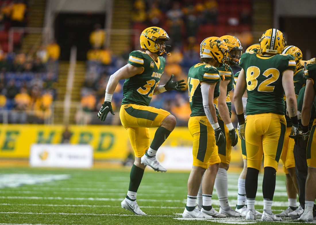 North Dakota State kicker Nathan Whiting warms up his leg during a huddle in the Dakota Marker rivalry game on Saturday, April 17, 2021, at the Fargodome in Fargo.

Dakota Marker 015