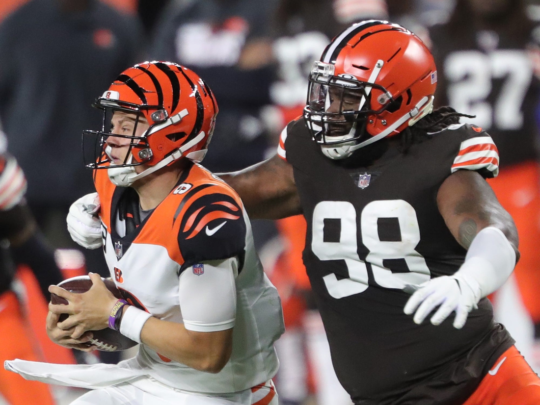 Cleveland Browns defensive tackle Sheldon Richardson (98) sacks Cincinnati Bengals quarterback Joe Burrow (9) during the first half of an NFL football game at FirstEnergy Stadium, Thursday, Sept. 17, 2020, in Cleveland, Ohio. [Jeff Lange/Beacon Journal]Browns 23