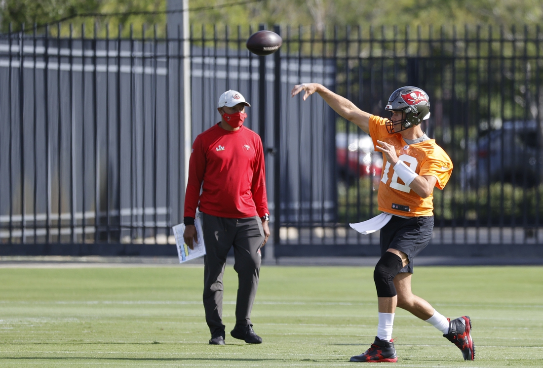 Jun 8, 2021; Tampa, FL, USA; Tampa Bay Buccaneers quarterback Tom Brady (12) works out during mini camp at AdventHealth Training Center. Mandatory Credit: Kim Klement-USA TODAY Sports