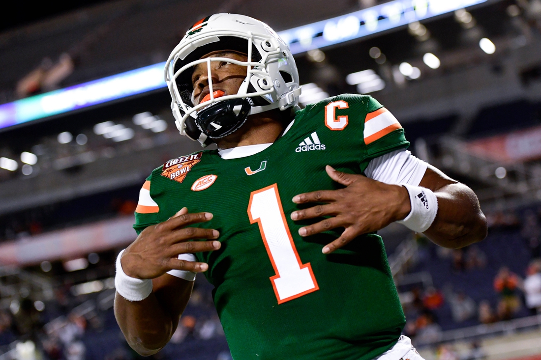 Dec 29, 2020; Orlando, FL, USA; Miami Hurricanes quarterback D'Eriq King (1) reacts after running the ball in for a touchdown which is called back for a penalty during the first half against the Oklahoma State Cowboys during the Cheez-It Bowl Game at Camping World Stadium. Mandatory Credit: Douglas DeFelice-USA TODAY Sports