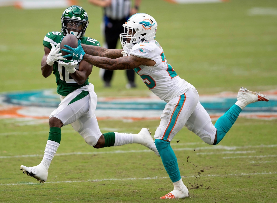 Miami Dolphins cornerback Xavien Howard (25) intercepts a pass intended for New York Jets wide receiver Jeff Smith (16) in the second quarter Sunday at Hard Rock Stadium in Miami Gardens.

Syndication Palm Beach Post