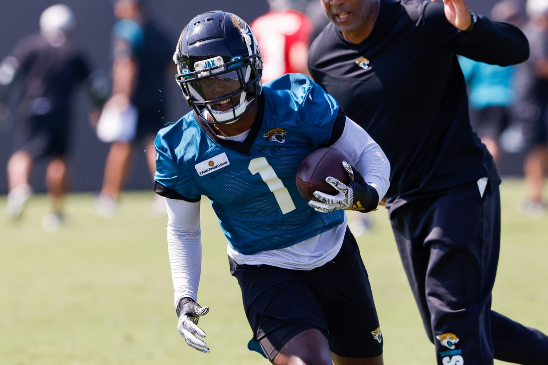 Jul 29, 2021; Jacksonville, FL, USA;  Jacksonville Jaguars running back Travis Etienne (1) participates in training camp at Dream Finders Homes practice field Mandatory Credit: Nathan Ray Seebeck-USA TODAY Sports