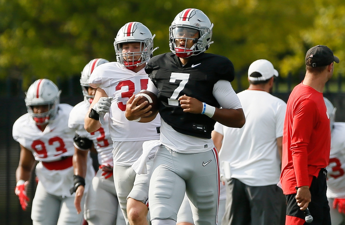 Ohio State Buckeyes quarterback C.J. Stroud (7) jogs during warm-ups for football training camp at the Woody Hayes Athletic Center in Columbus on Tuesday, Aug. 10, 2021.

Ohio State Football Training Camp