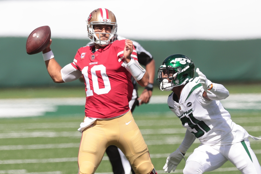 Sep 20, 2020; East Rutherford, New Jersey, USA; San Francisco 49ers quarterback Jimmy Garoppolo (10) throws a pass during the first quarter as New York Jets cornerback Blessuan Austin (31) defends at MetLife Stadium. Mandatory Credit: Vincent Carchietta-USA TODAY Sports