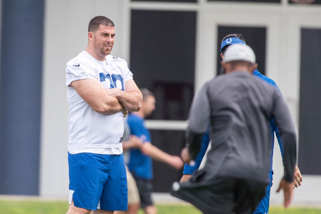 May 27, 2021; Indianapolis, Indiana, USA; Indianapolis Colts offensive tackle Eric Fisher (79) talks with coaches during Indianapolis Colts OTAs. Mandatory Credit: Trevor Ruszkowski-USA TODAY Sports