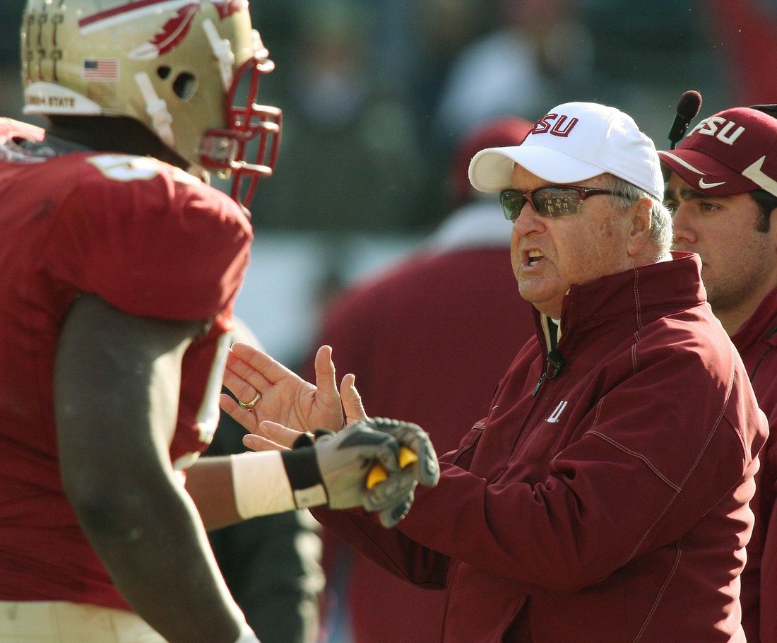 Jan. 1, 2010: Bobby Bowden congratulates his players as they leave the field following a third quarter touchdown during his final game against West Virginia at Jacksonville Municipal Stadium for the Gator Bowl. [Kelly Jordan, Florida Times-Union]