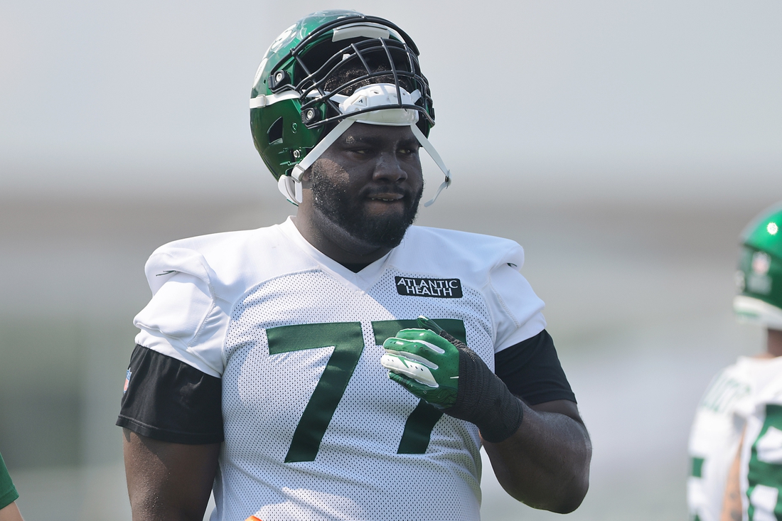 Jul 28, 2021; Florham Park, NJ, United States; New York Jets offensive tackle Mekhi Becton (77) looks on during training camp at Atlantic Health Jets Training Center. Mandatory Credit: Vincent Carchietta-USA TODAY Sports