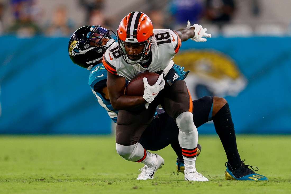Aug 14, 2021; Jacksonville, Florida, USA;  Cleveland Browns wide receiver Davion Davis (18) is tackled by Jacksonville Jaguars safety Andre Cisco (38) in the second quarter at TIAA Bank Field. Mandatory Credit: Nathan Ray Seebeck-USA TODAY Sports