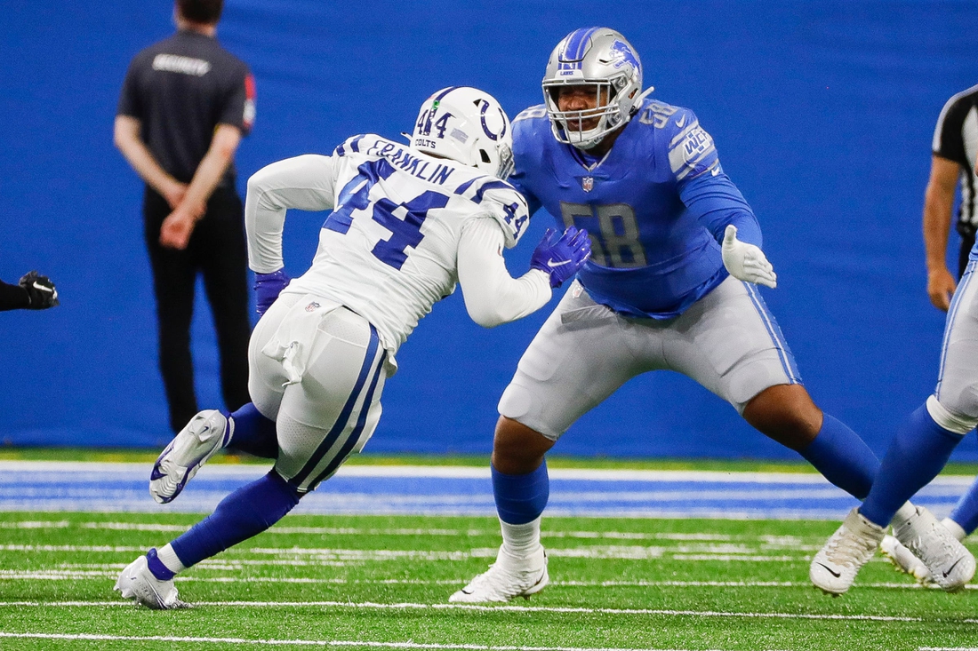 Detroit Lions offensive tackle Penei Sewell (58) plays against Indianapolis Colts linebacker Zaire Franklin (44) during the first half of a preseason game at Ford Field in Detroit, Friday, August 27, 2021.