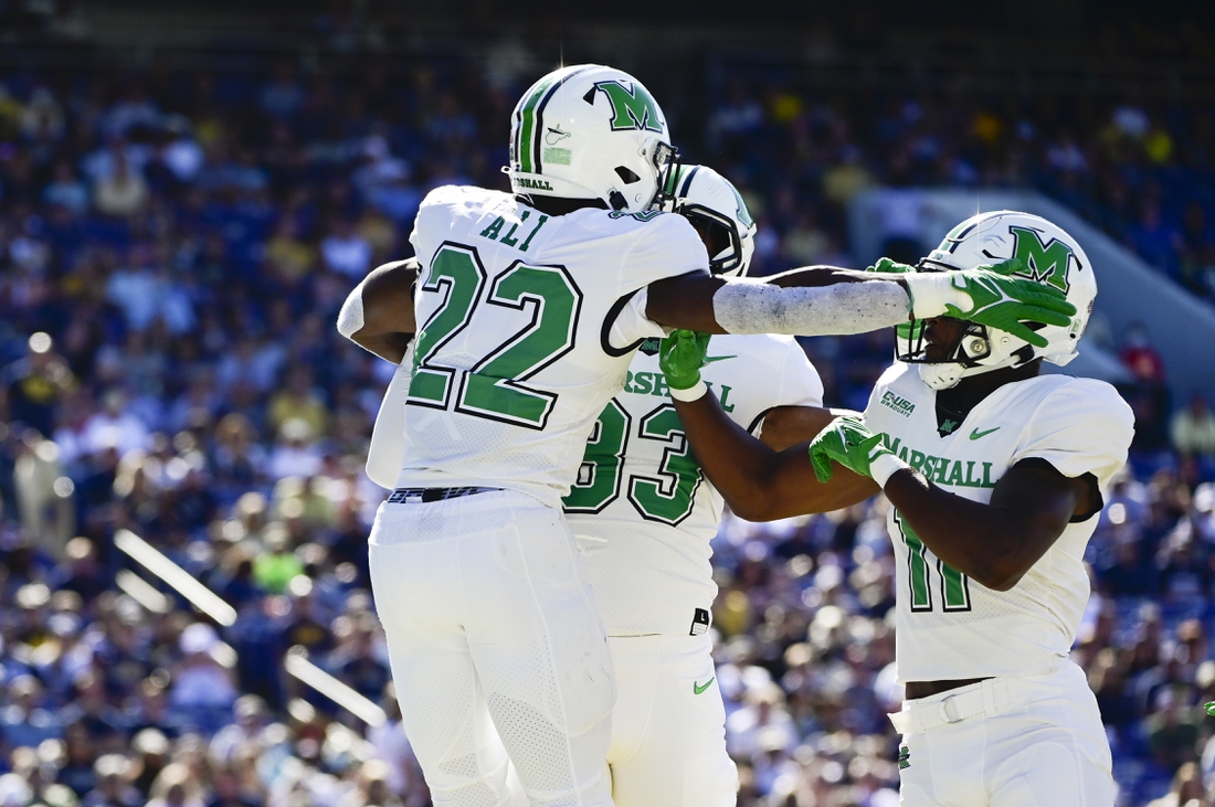 Sep 4, 2021; Annapolis, Maryland, USA; Marshall Thundering Herd running back Rasheen Ali (22) celebrates with  tight end Devin Miller (83) and tight end Xavier Gaines (11) after scoring a first half touchdown against the Navy Midshipmen  at Navy-Marine Corps Memorial Stadium. Mandatory Credit: Tommy Gilligan-USA TODAY Sports