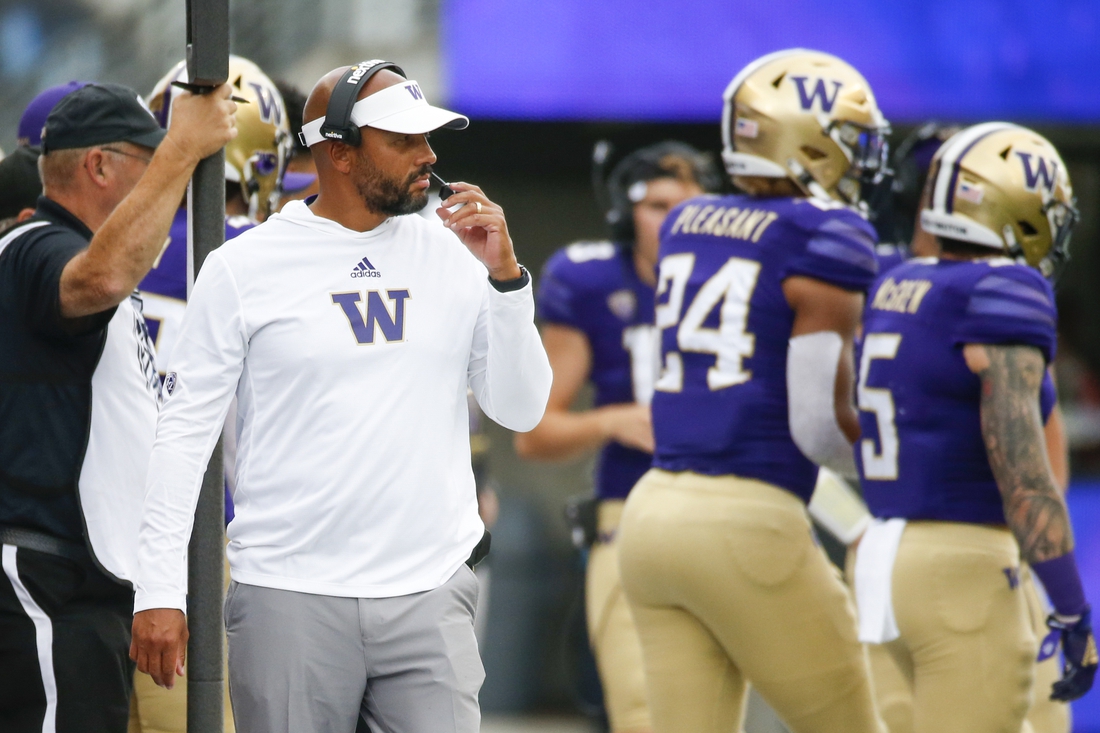 Sep 4, 2021; Seattle, Washington, USA; Washington Huskies head coach Jimmy Lake stands on the sideline during the second quarter against the Montana Grizzlies at Alaska Airlines Field at Husky Stadium. Mandatory Credit: Joe Nicholson-USA TODAY Sports