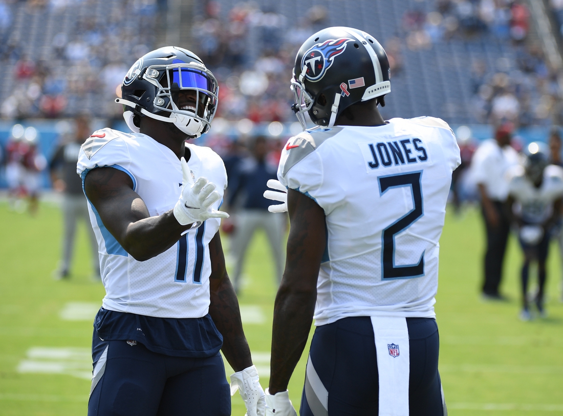Sep 12, 2021; Nashville, Tennessee, USA; Tennessee Titans wide receiver A.J. Brown (11) and Tennessee Titans wide receiver Julio Jones (2) before the game against the Arizona Cardinals at Nissan Stadium. Mandatory Credit: Christopher Hanewinckel-USA TODAY Sports