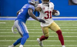 Sep 12, 2021; Detroit, Michigan, USA; San Francisco 49ers running back Raheem Mostert (31) puts a stiff arm to the helmet of Detroit Lions defensive back Will Harris (25) in the first quarter at Ford Field. Mandatory Credit: David Reginek-USA TODAY Sports