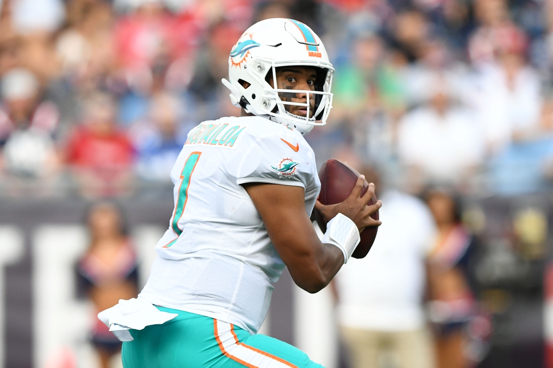 Sep 12, 2021; Foxborough, Massachusetts, USA; Miami Dolphins quarterback Tua Tagovailoa (1) looks to pass against the New England Patriots during the first half at Gillette Stadium. Mandatory Credit: Brian Fluharty-USA TODAY Sports