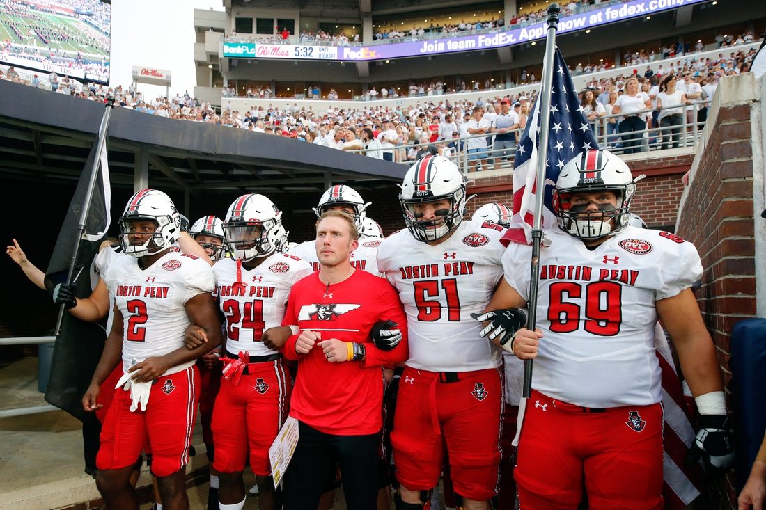 Sep 11, 2021; Oxford, Mississippi, USA; Austin Peay Governors head coach Scotty Walden (middle), offensive linemen Garrett Bell (57), wide receiver Trey Goodman (24), offensive linemen Colby McKee (51) and offensive linemen Michael Treadwell (69) prepare to run out of the tunnel before their game against the Mississippi Rebels at Vaught-Hemingway Stadium. Mandatory Credit: Petre Thomas-USA TODAY Sports