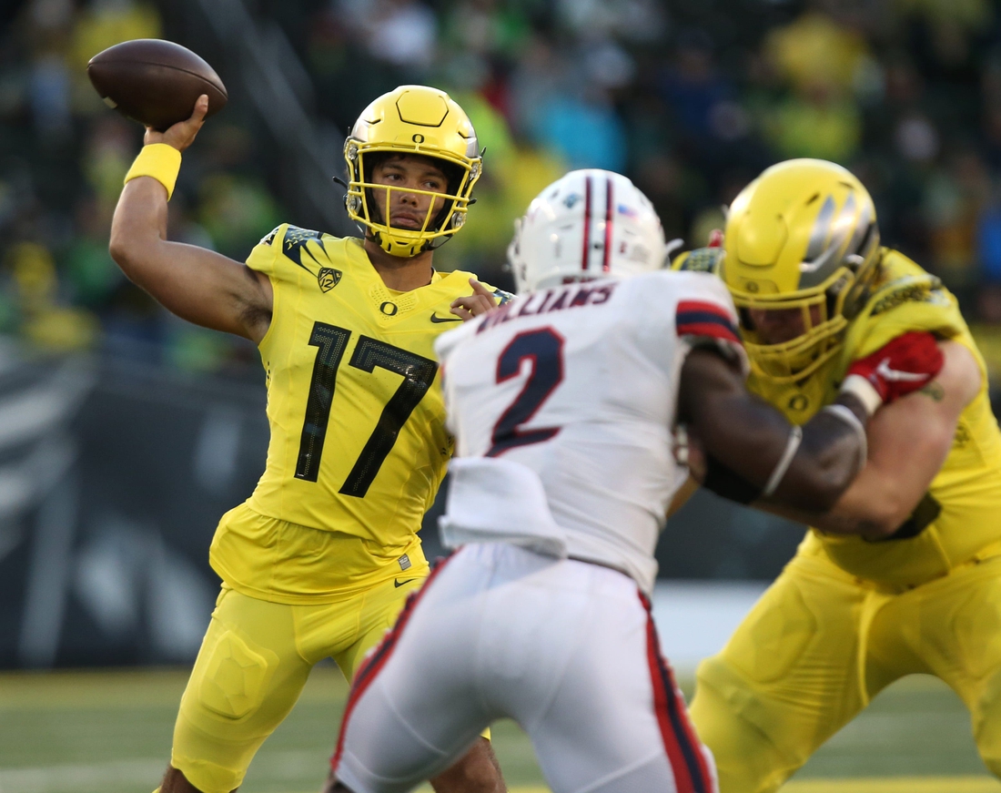 Oregon's Ty Thompson, left, throws down field against Stony Brook during the third quarter.

Eug 091821 Oregonfb 14
